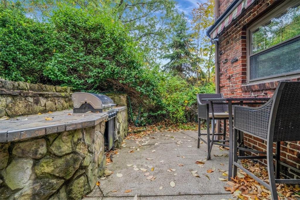 21 Marquette Road Pittsburgh, PA 15229 - Photo 37 of 44 a view of a patio with table and chairs with wooden fence