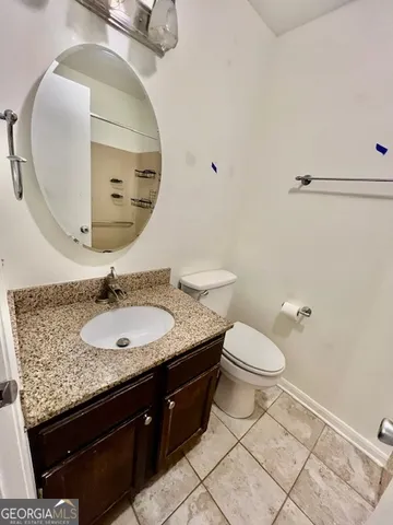 a bathroom with a toilet and a sink
