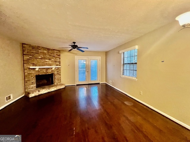 2515 Skyland Trail Northeast Brookhaven, GA 30319 - Photo 15 of 41 a view of an empty room with a fireplace and a window