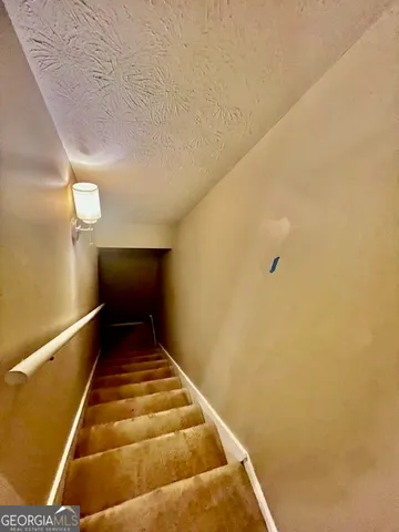 a view of a wooden deck next to a yard