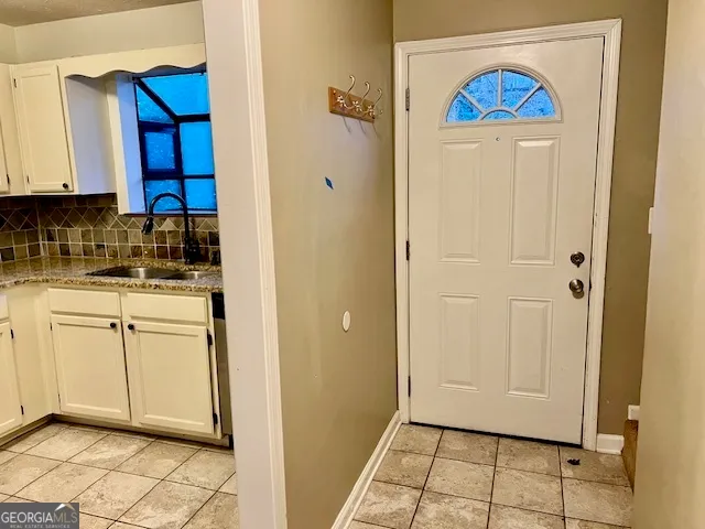 a view of a kitchen with appliances and cabinets