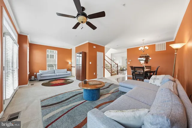 a bedroom with furniture and a large window