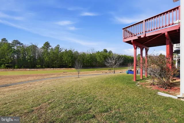 a balcony with wooden floor and fence