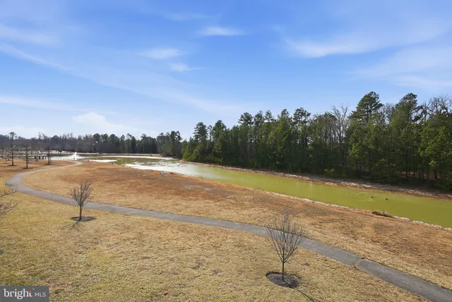 a picture of a bench in front of a wall