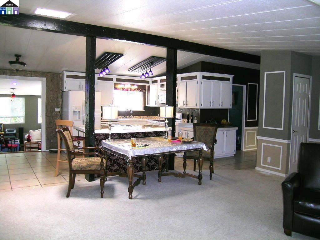 681 Tyler Island Bridge Road Isleton, CA 95641 - Photo 11 of 24 a dining room with furniture and a floor to ceiling window