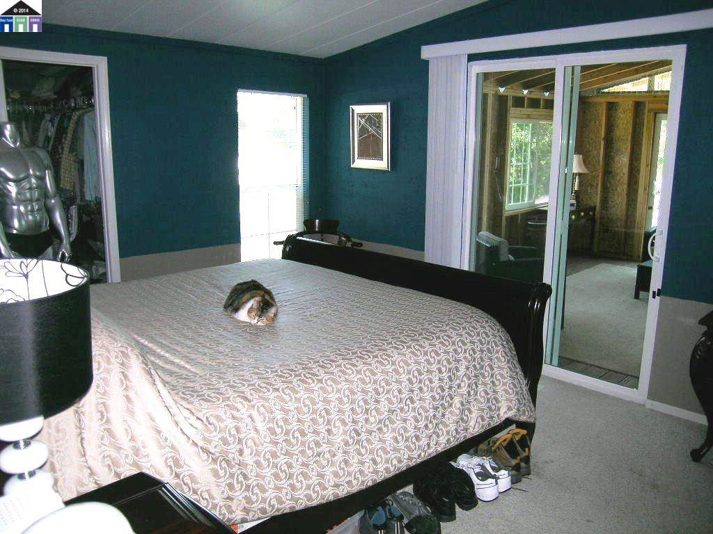 681 Tyler Island Bridge Road Isleton, CA 95641 - Photo 14 of 24 a bedroom with a bed and window