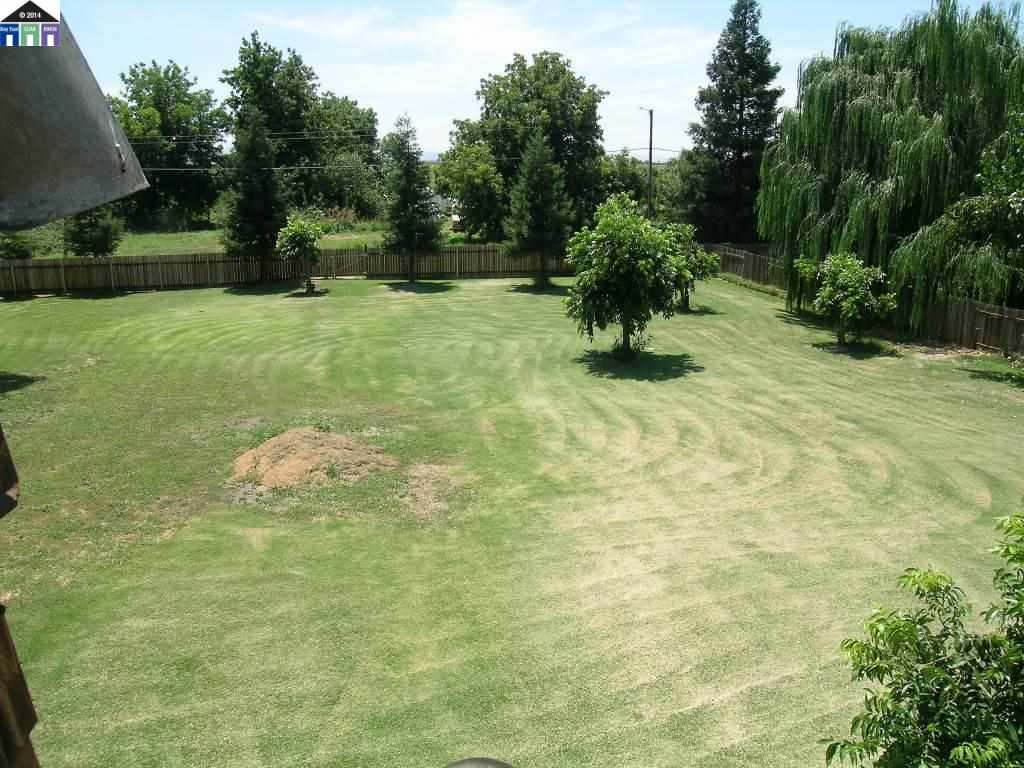 681 Tyler Island Bridge Road Isleton, CA 95641 - Photo 6 of 24 a view of a garden with a bench