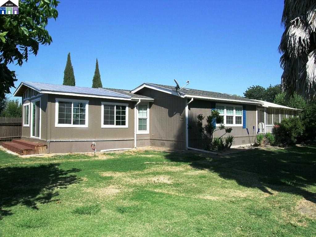 681 Tyler Island Bridge Road Isleton, CA 95641 - Photo 8 of 24 a front view of a house with a yard