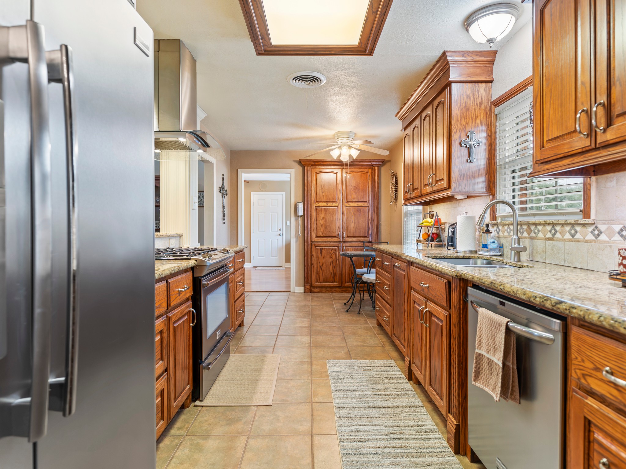 910 6th Street Bay City, TX 77414 - Photo 11 of 34 a large kitchen with stainless steel appliances granite countertop a refrigerator a sink and dishwasher