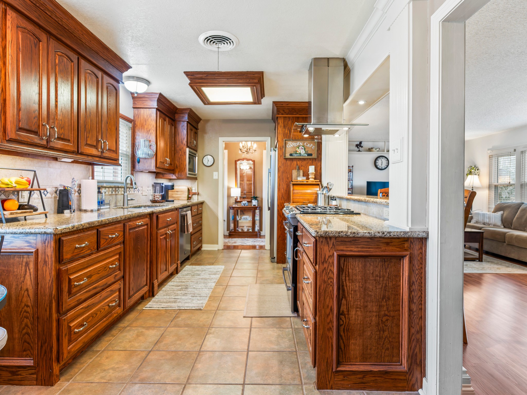 910 6th Street Bay City, TX 77414 - Photo 14 of 34 a large kitchen with stainless steel appliances granite countertop a stove and cabinets