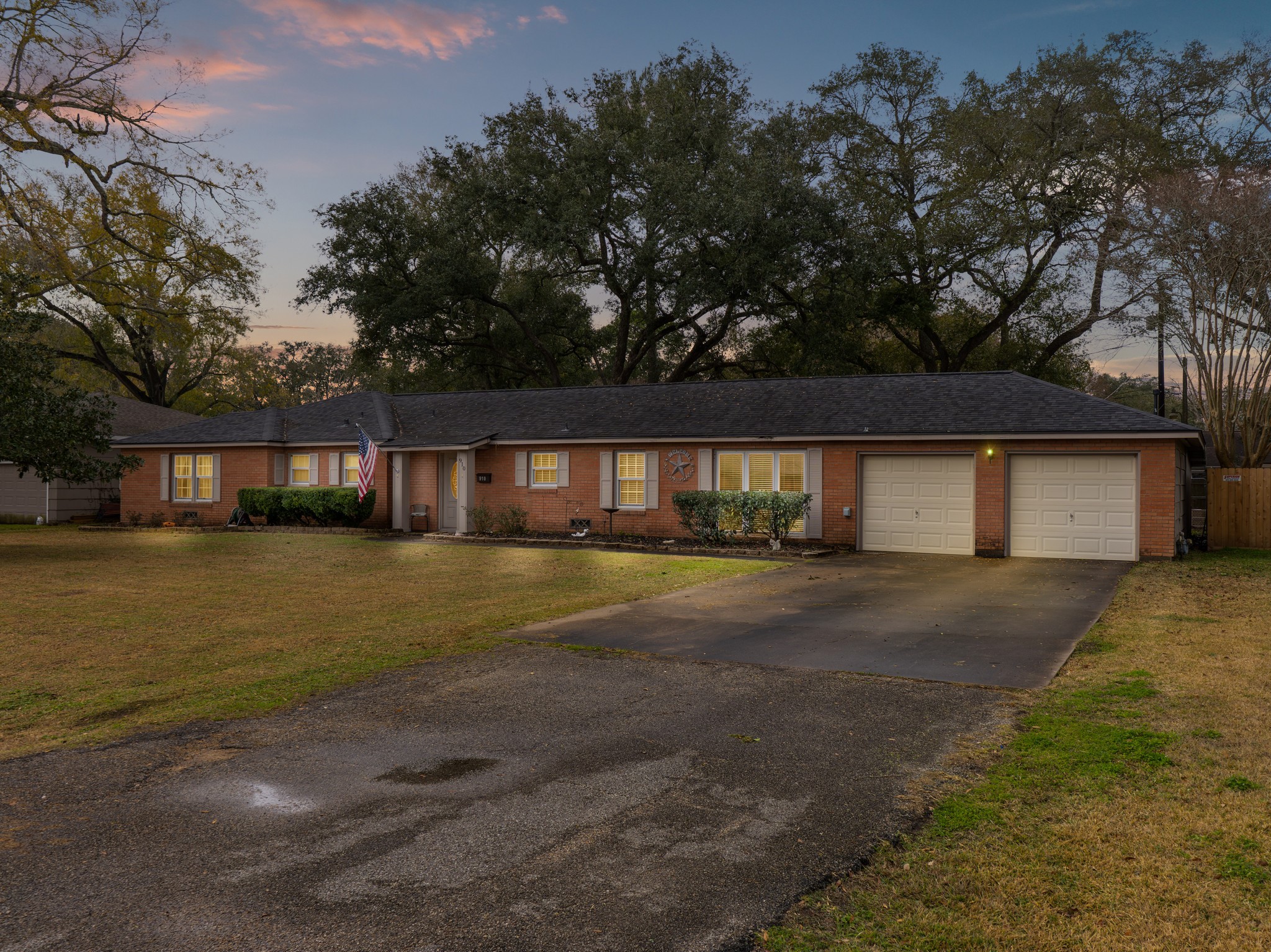 910 6th Street Bay City, TX 77414 - Photo 2 of 34 a front view of a house with a yard and lake view