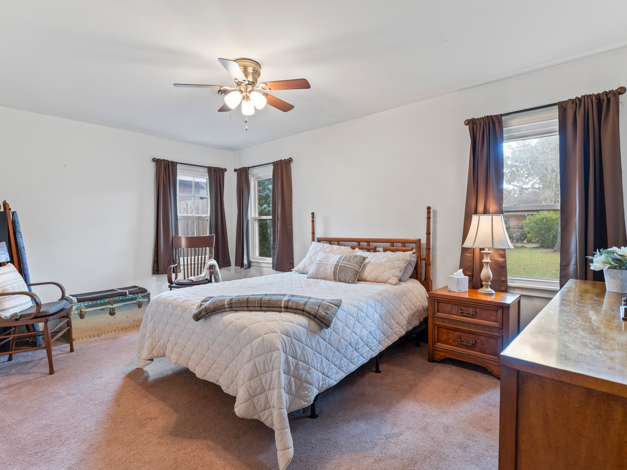 910 6th Street Bay City, TX 77414 - Photo 26 of 34 a bed room with a bed and a chandelier