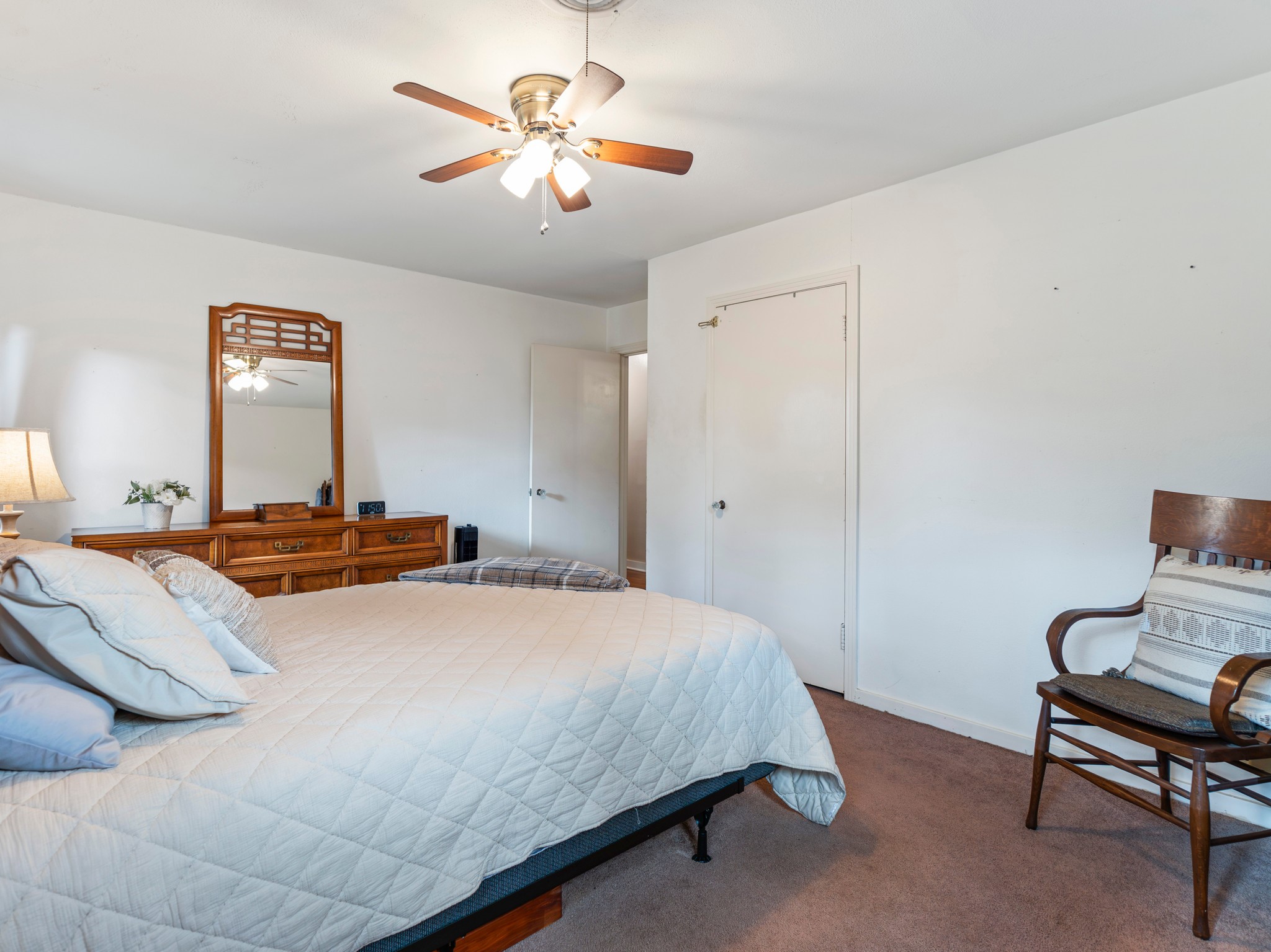 910 6th Street Bay City, TX 77414 - Photo 27 of 34 a bedroom with a bed and a chandelier