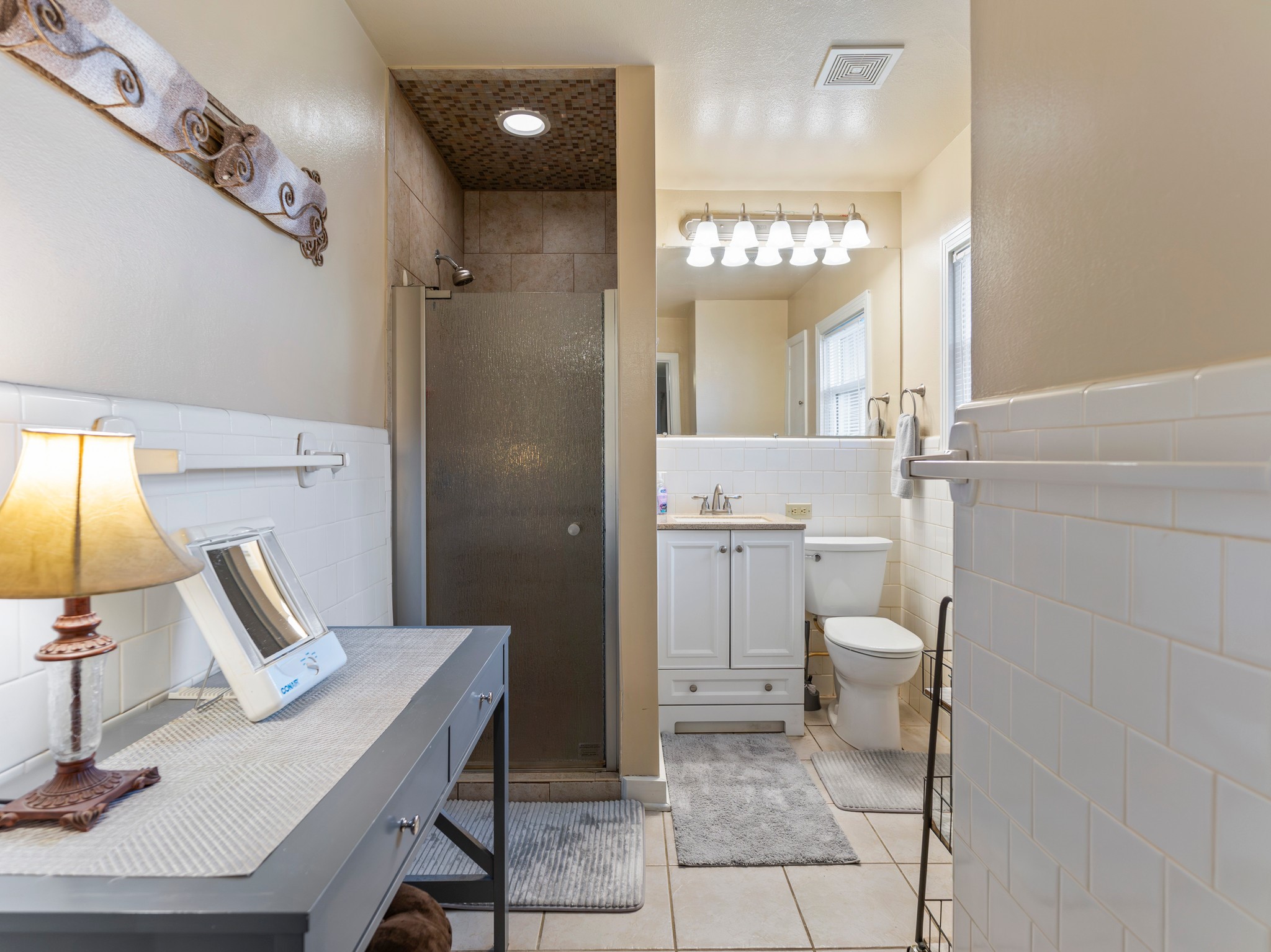 910 6th Street Bay City, TX 77414 - Photo 31 of 34 a bathroom with a sink a toilet and a mirror