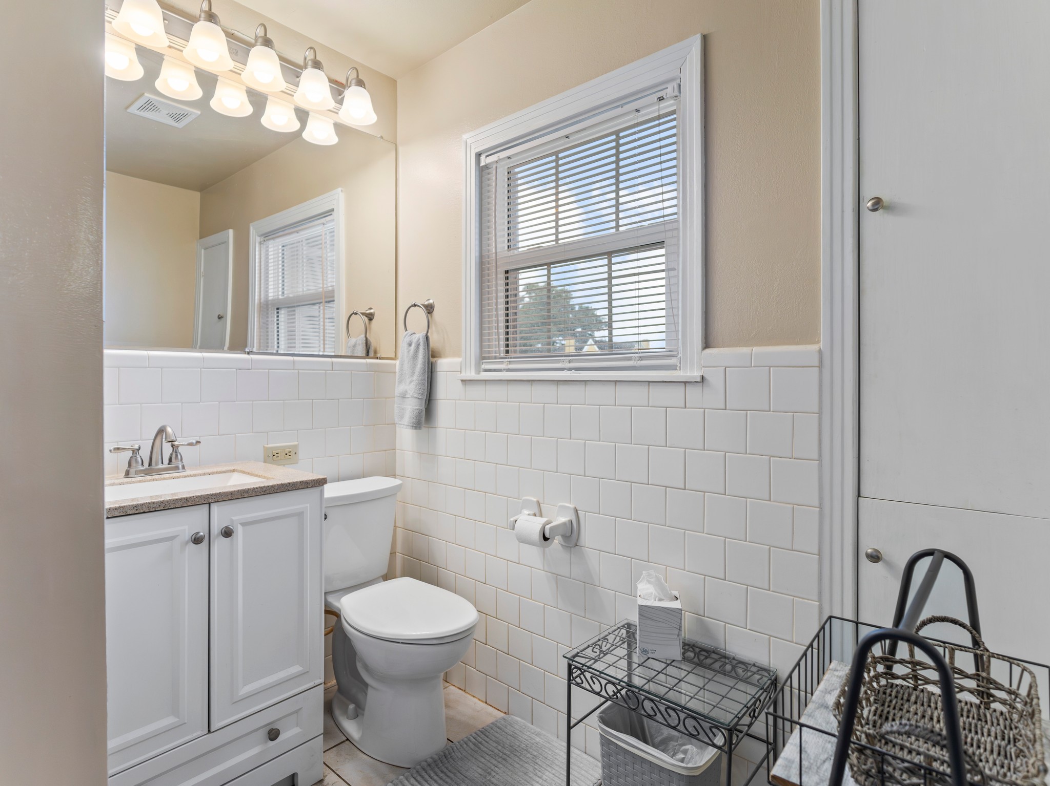 910 6th Street Bay City, TX 77414 - Photo 32 of 34 a bathroom with a toilet a sink and mirror