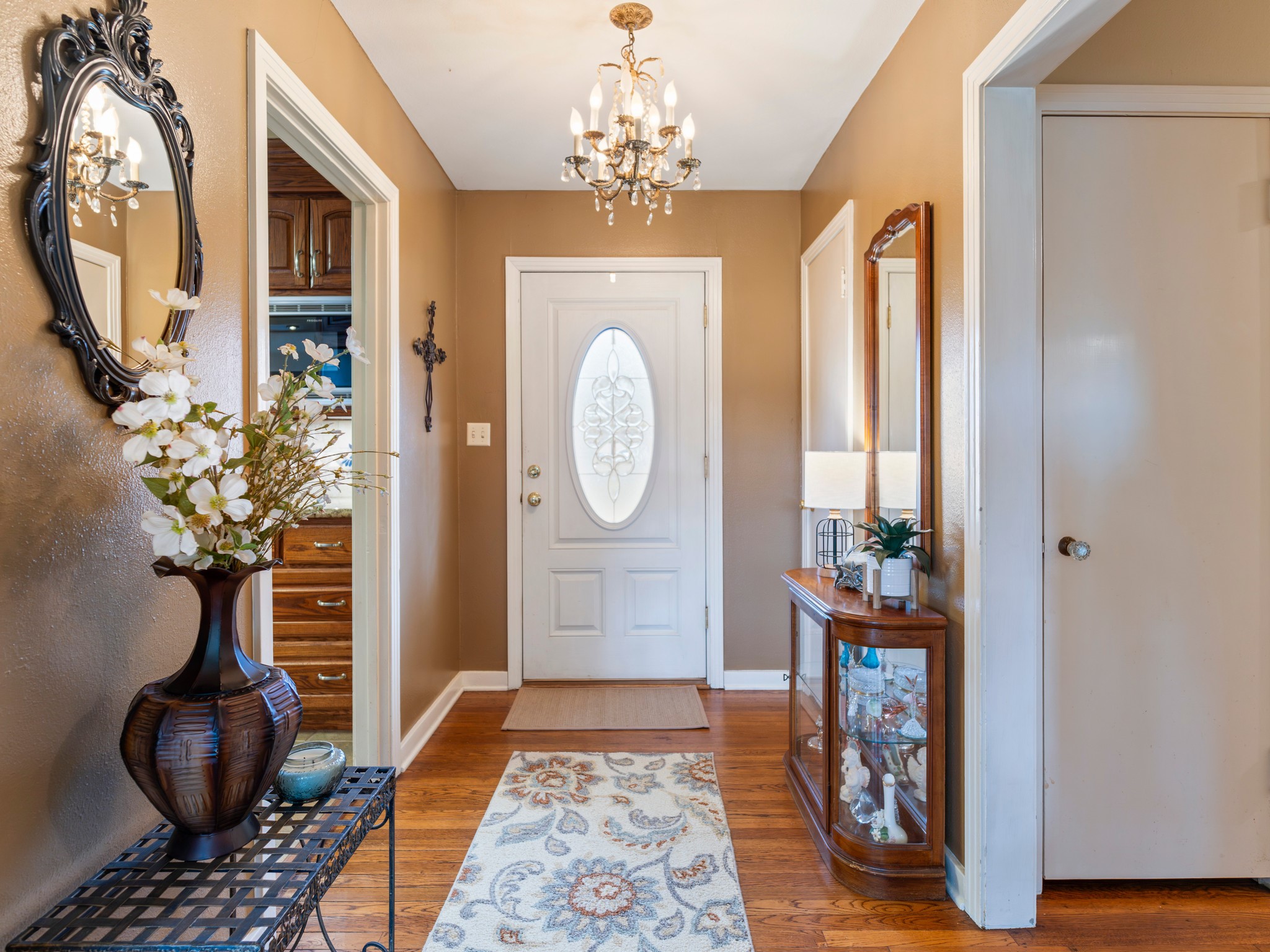910 6th Street Bay City, TX 77414 - Photo 10 of 34 a living room with furniture and a chandelier