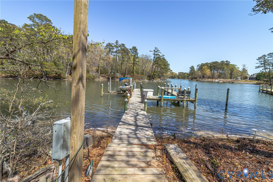 176 Baypointe Court Reedville, VA 22539 - Photo 7 of 60 a view of a lake with outdoor seating