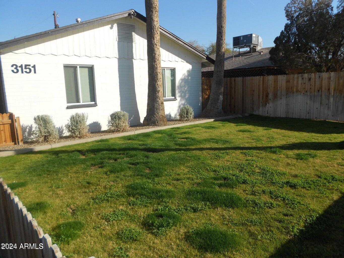 3151 North 36th Street, Unit 5 Phoenix, AZ 85018 - Photo 1 of 13 a bathroom with a sink and mirror
