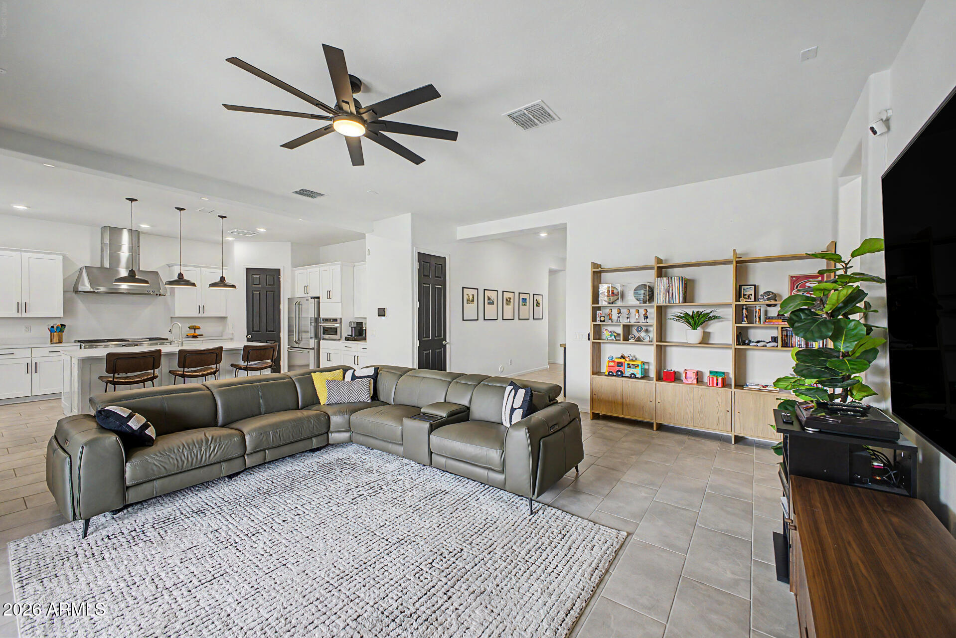 6511 West Steed Ridge Phoenix, AZ 85083 - Photo 8 of 41 a living room with furniture ceiling fan and a window