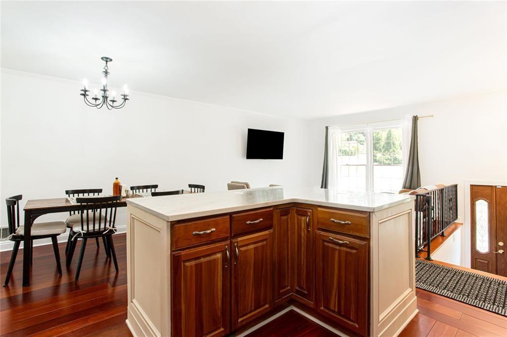 2814 Goodfellows Road Tucker, GA 30084 - Photo 21 of 46 a view of a kitchen with a sink wooden cabinets and appliances