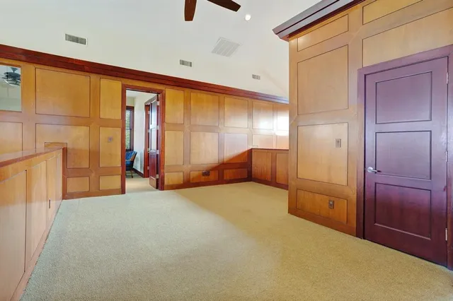 a spacious bathroom with a granite countertop sink and a mirror