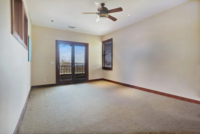 a view of a kitchen with stainless steel appliances granite countertop cabinets and a window