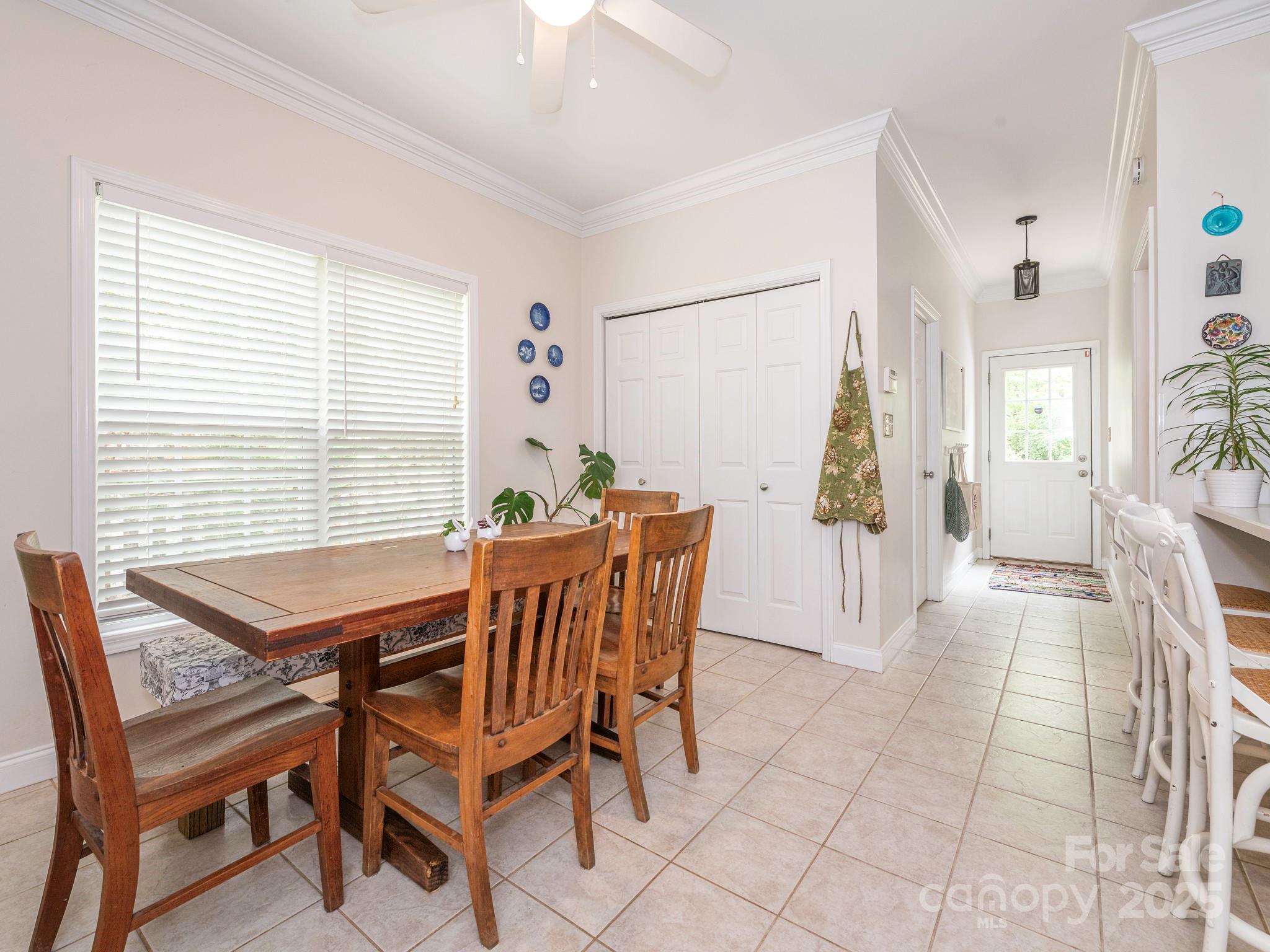 3033 Beech Court Indian Trail, NC 28079 - Photo 12 of 39 a dining room with furniture and large windows