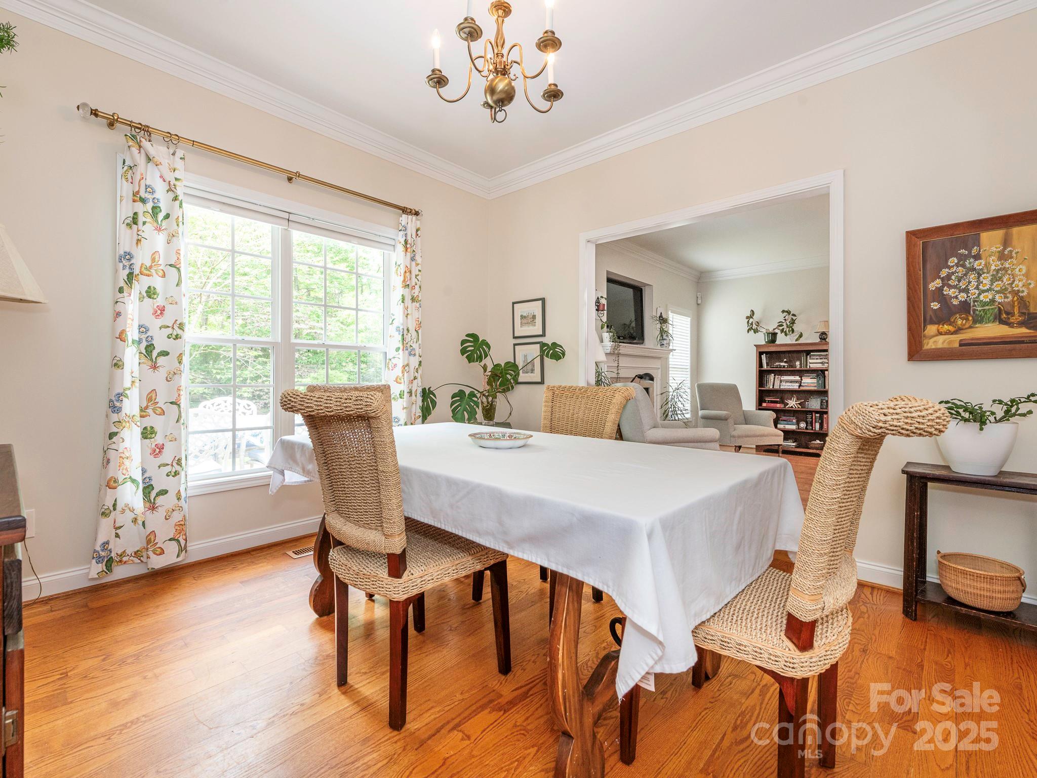 3033 Beech Court Indian Trail, NC 28079 - Photo 14 of 39 a view of a dining room with furniture window and wooden floor