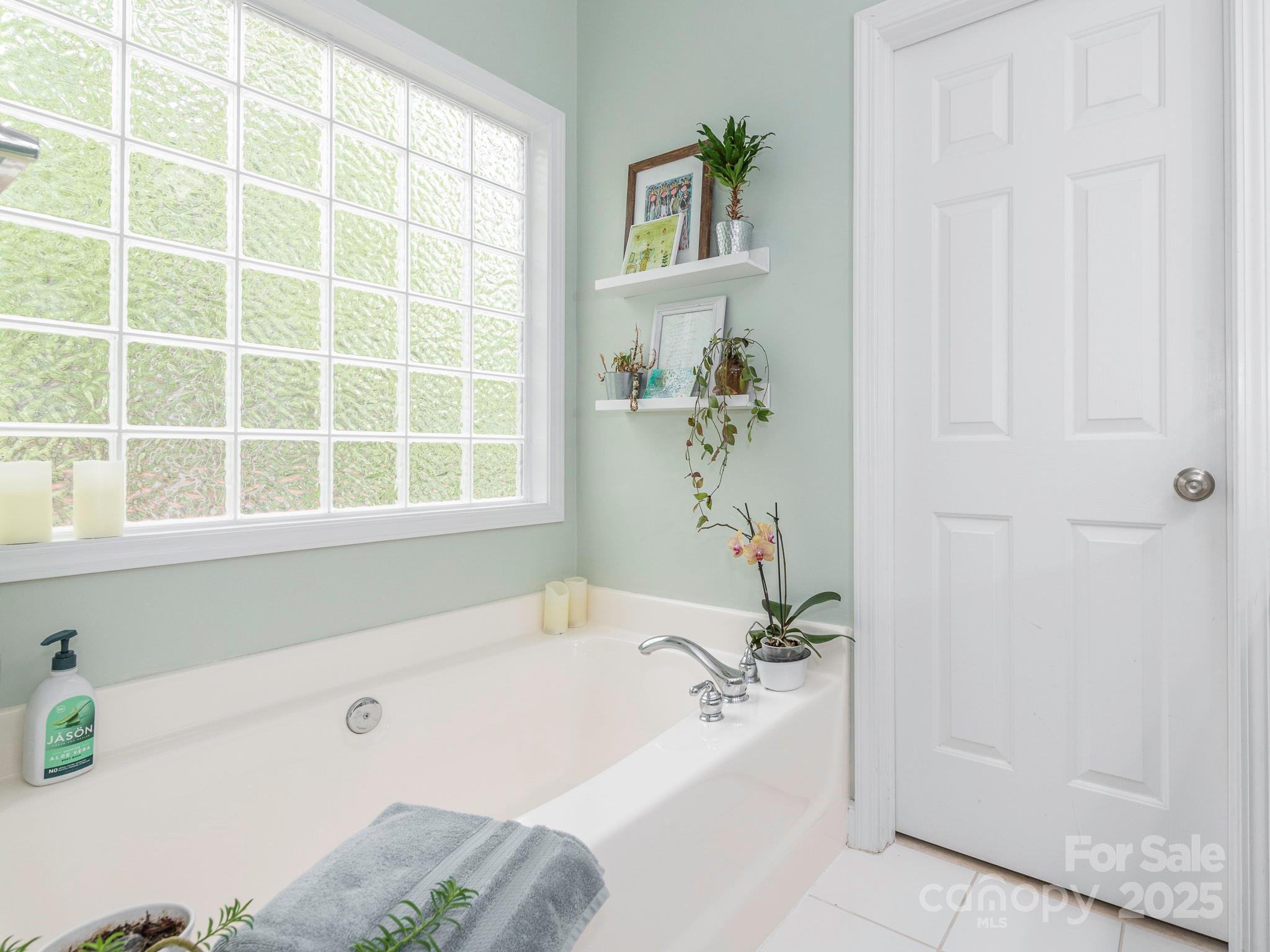 3033 Beech Court Indian Trail, NC 28079 - Photo 16 of 39 a bath tub sitting next to a window
