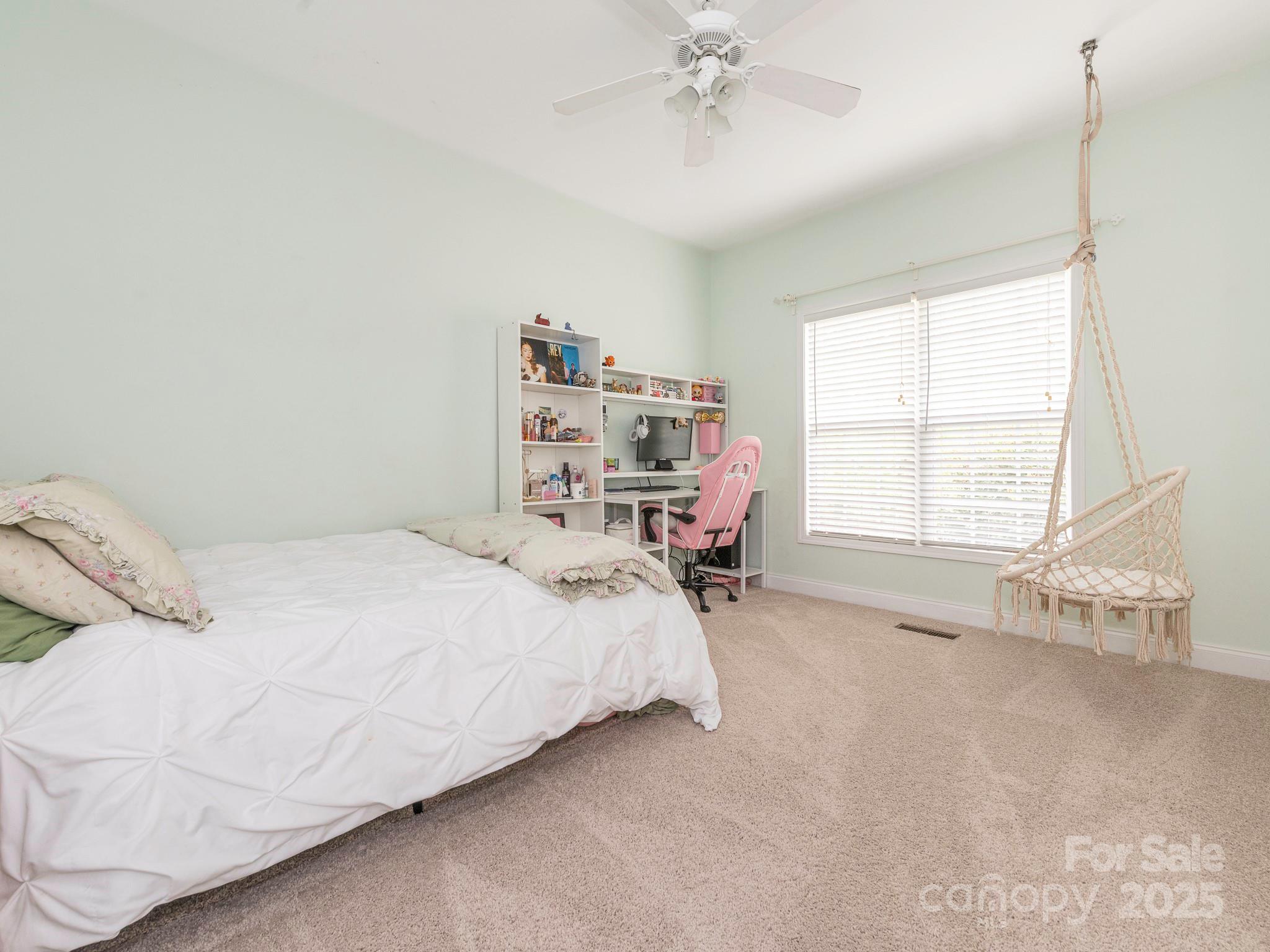 3033 Beech Court Indian Trail, NC 28079 - Photo 20 of 39 a bedroom with a bed and a window
