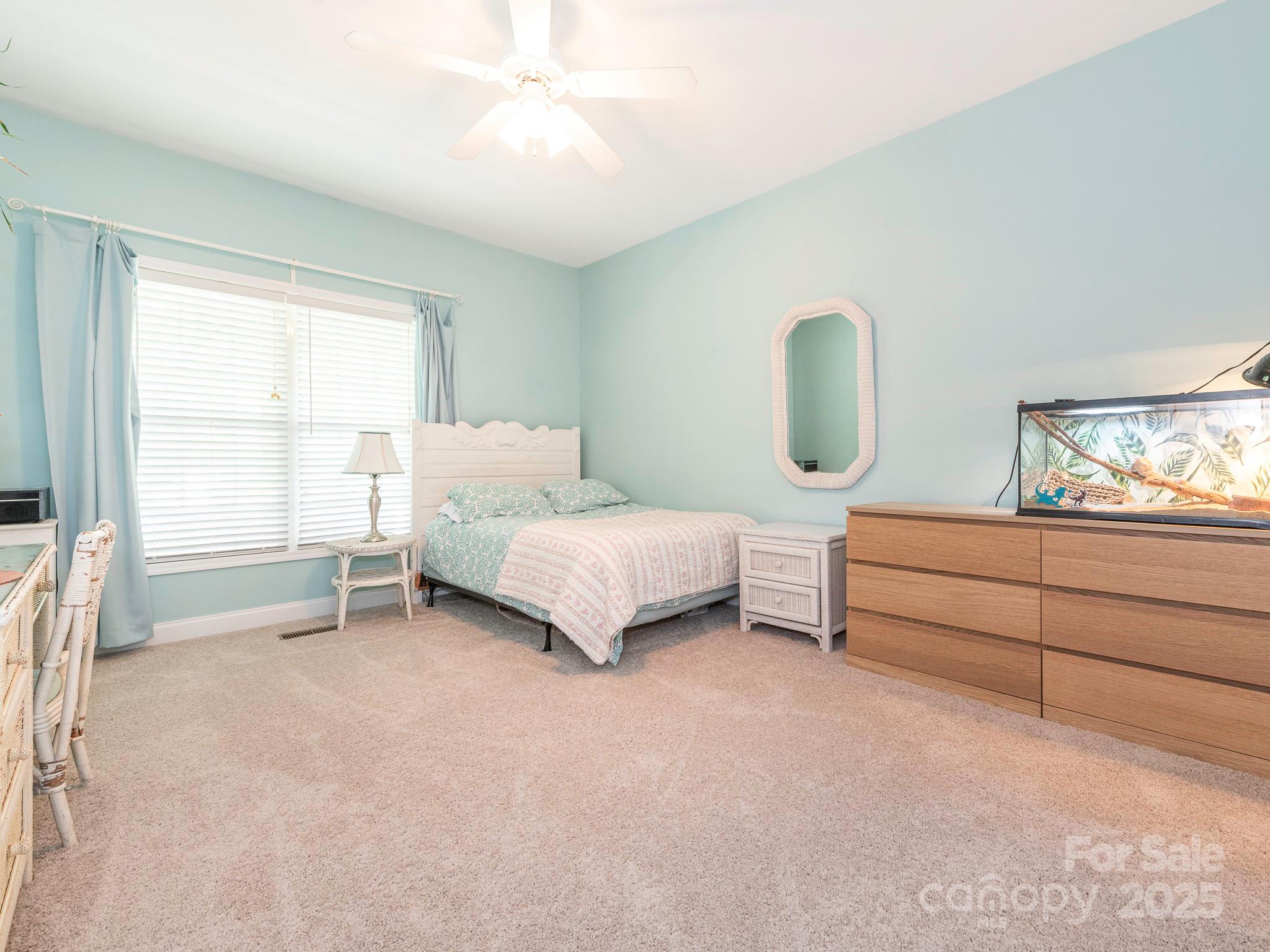 3033 Beech Court Indian Trail, NC 28079 - Photo 21 of 39 a bedroom with a bed lamp closet and window