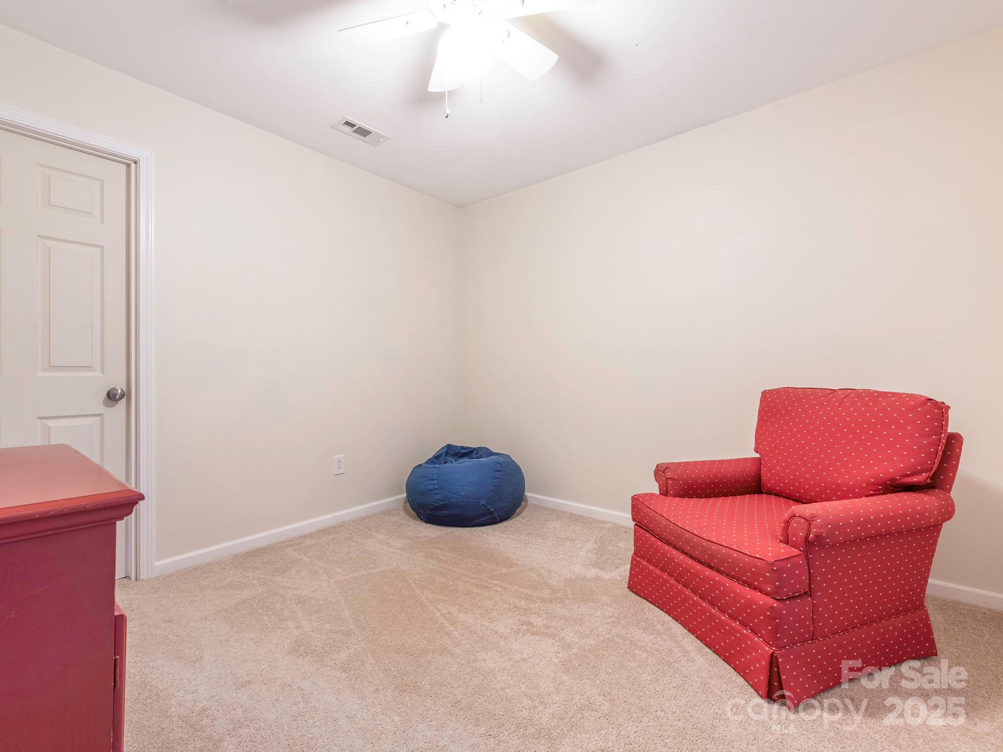 3033 Beech Court Indian Trail, NC 28079 - Photo 29 of 39 a room with furniture and a chair