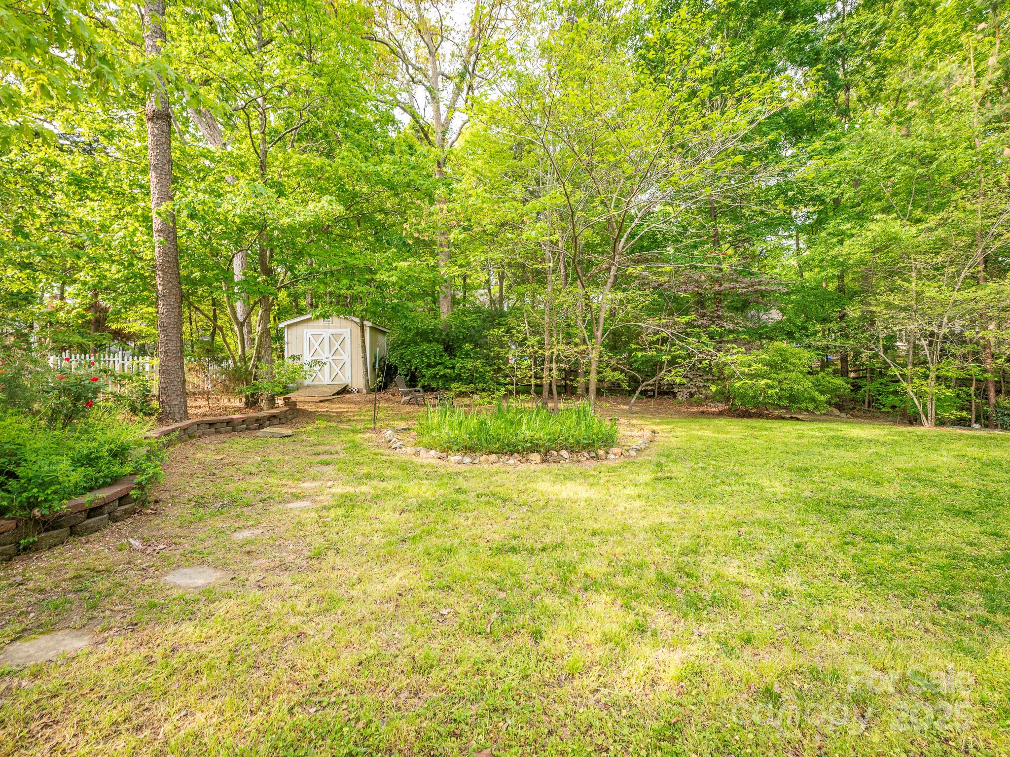 3033 Beech Court Indian Trail, NC 28079 - Photo 37 of 39 a view of a garden with trees