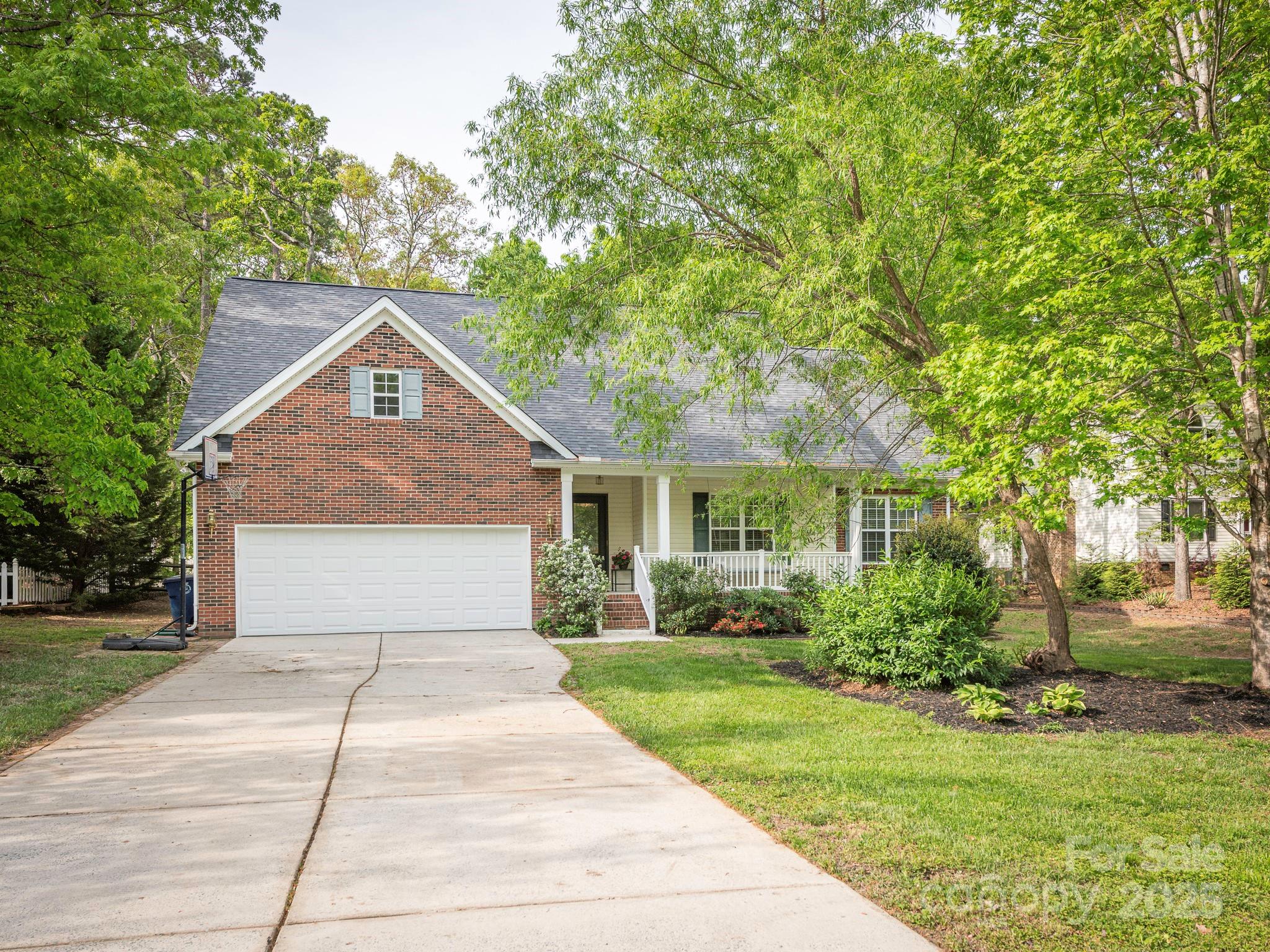 3033 Beech Court Indian Trail, NC 28079 - Photo 39 of 39 a front view of a house with a yard and trees