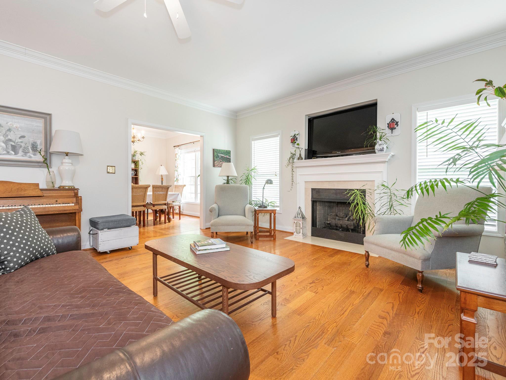 3033 Beech Court Indian Trail, NC 28079 - Photo 5 of 39 a living room with furniture fireplace and flat screen tv