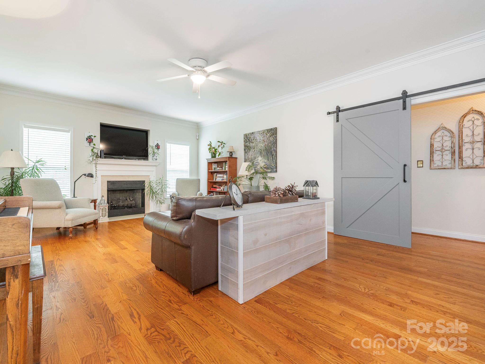 3033 Beech Court Indian Trail, NC 28079 - Photo 7 of 39 a living room with furniture fireplace and flat screen tv