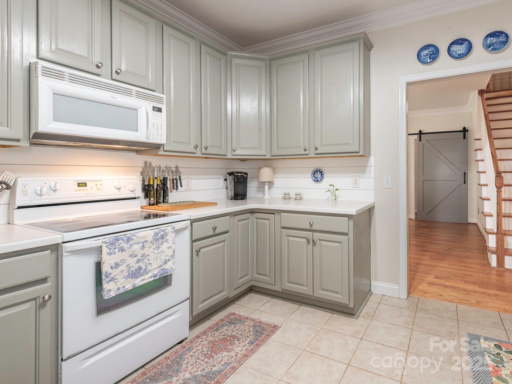 3033 Beech Court Indian Trail, NC 28079 - Photo 10 of 39 a kitchen with a sink cabinets and window