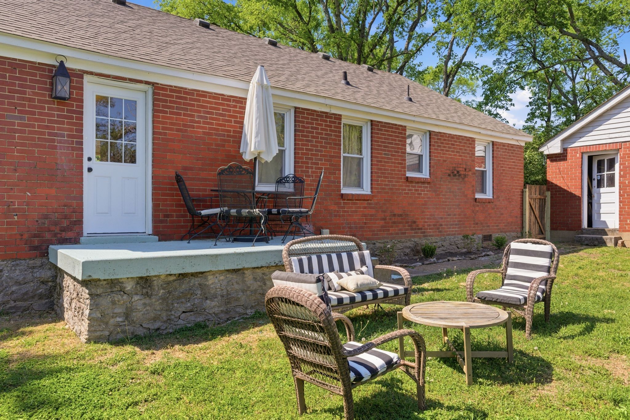 926 Idlewild Drive Madison, TN 37115 - Photo 25 of 25 a view of a patio with table and chairs with wooden fence