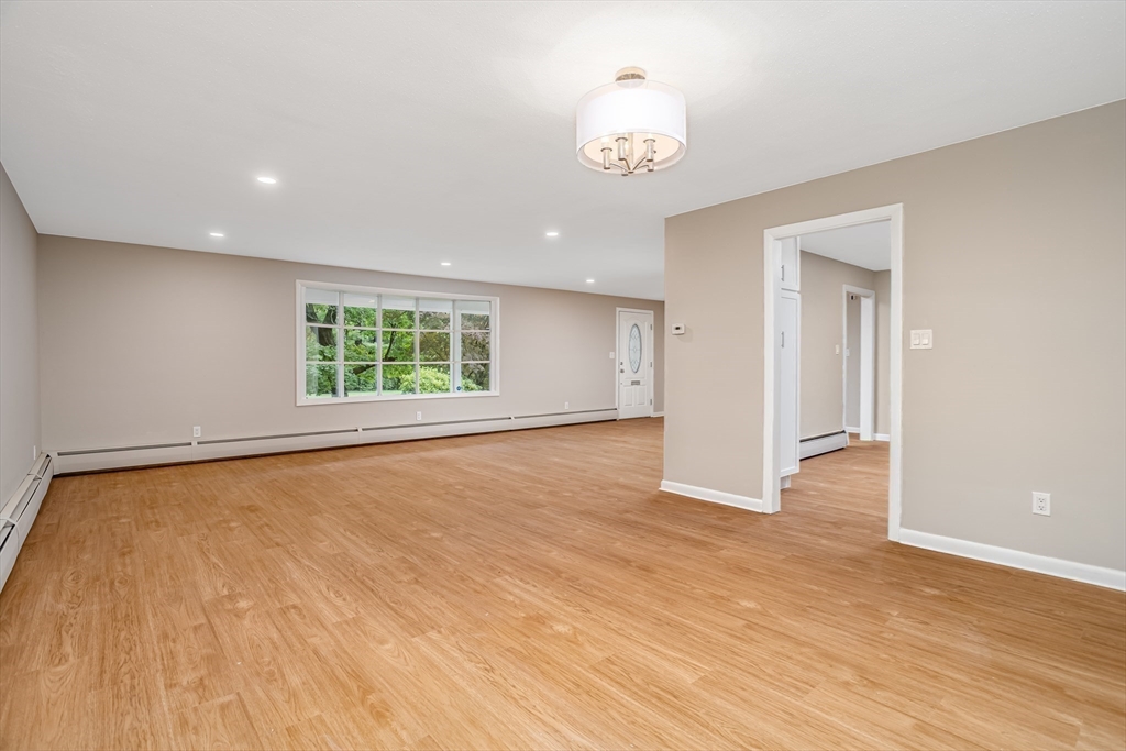 477 Salisbury Street Worcester, MA 01609 - Photo 13 of 42 an empty room with wooden floor and window