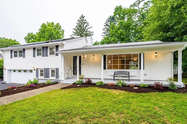 front view of a house with a yard