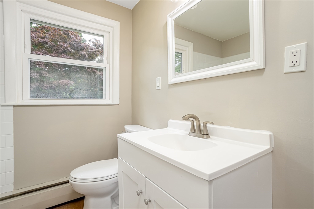 477 Salisbury Street Worcester, MA 01609 - Photo 26 of 42 a bathroom with a sink mirror and toilet