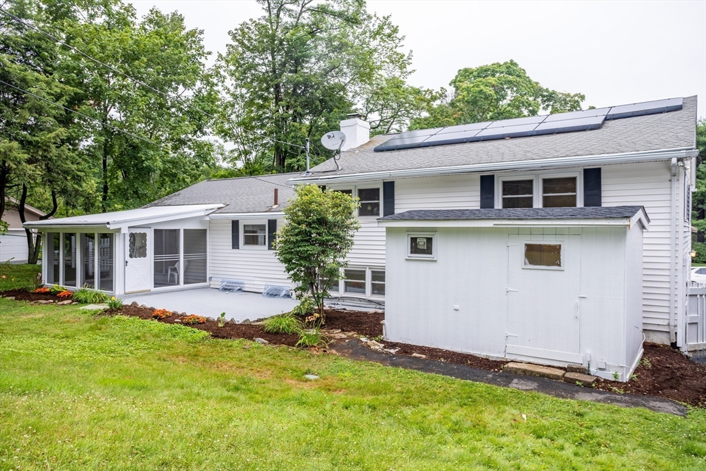 477 Salisbury Street Worcester, MA 01609 - Photo 3 of 42 a view of a house with a yard
