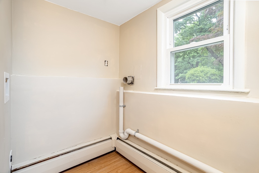 477 Salisbury Street Worcester, MA 01609 - Photo 31 of 42 a view of a small space with wooden floor and a window