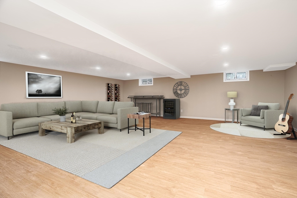 477 Salisbury Street Worcester, MA 01609 - Photo 33 of 42 a living room with furniture a rug and a lamp