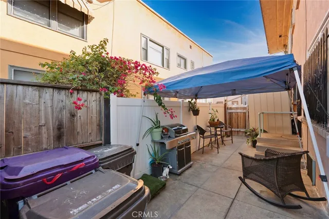 a view of a two chairs in the patio