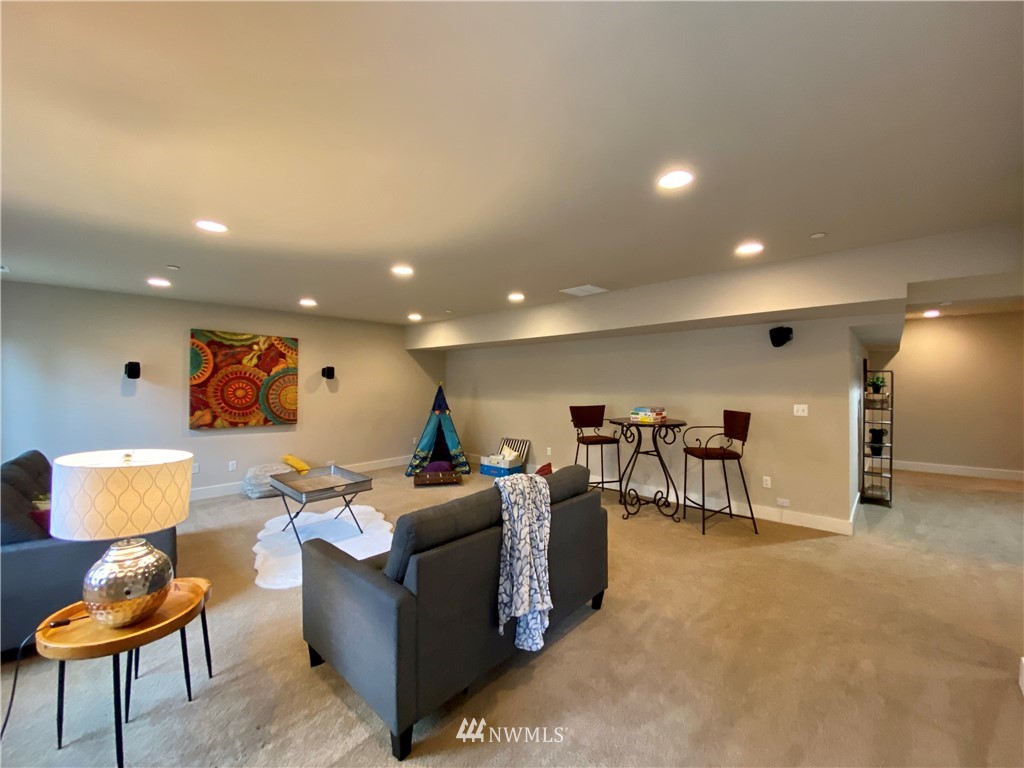 5208 Northeast 11th Place Renton, WA 98059 - Photo 22 of 29 a living room with furniture and a window