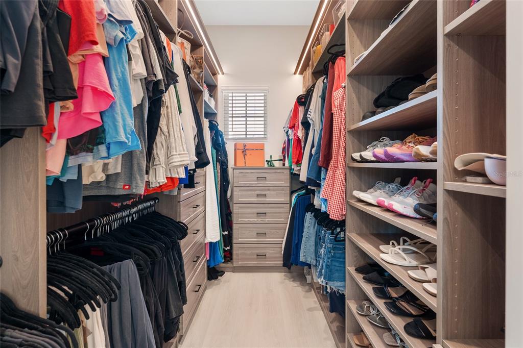 10175 Brocksport Circle Gotha, FL 34734 - Photo 23 of 54 a view of walk in closet with clothes and shoes