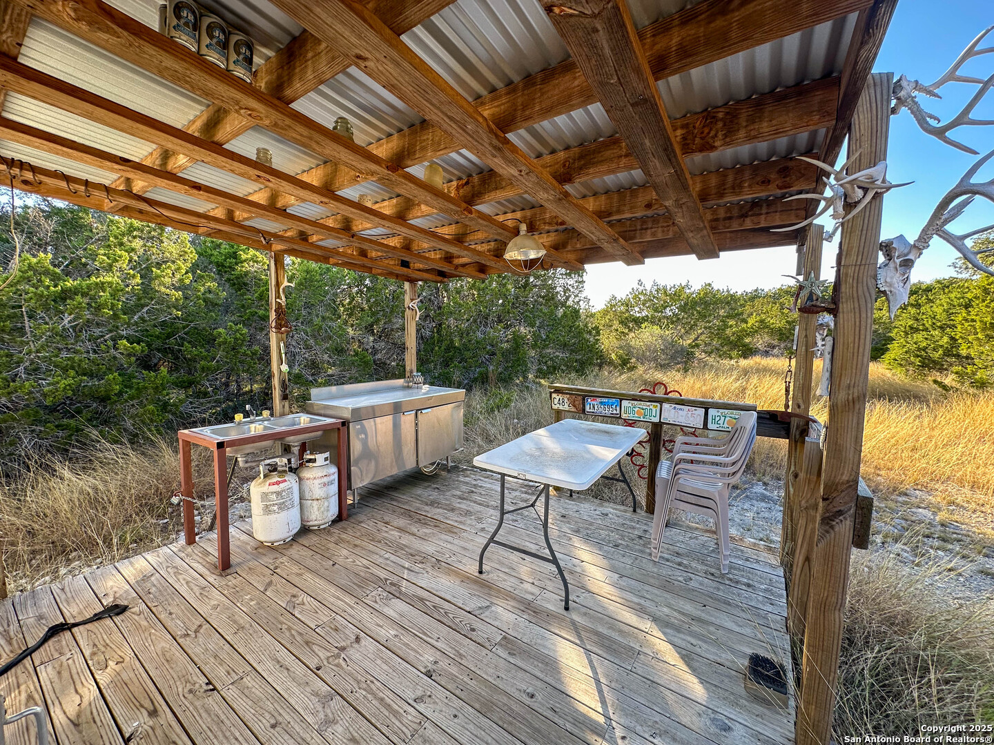 0 SD 31838 Rocksprings, TX 78880 - Photo 7 of 32 a view of a chairs and table on the wooden roof deck