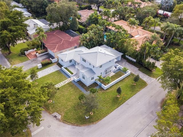 an aerial view of a house with a garden