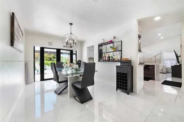 a kitchen with stainless steel appliances a refrigerator sink and stove
